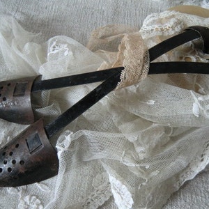 Old vintage metal shoe trees antique French shabby chic in the style of JDL