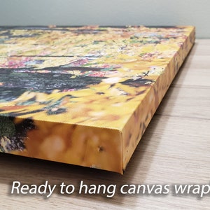 May include: A close-up of the side of a canvas print with a colorful abstract design. The canvas is wrapped around the edges, creating a finished look. "Ready to hang canvas wrap!" is written below the image.