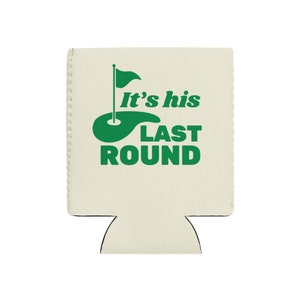 May include: White foam can cooler with a green golf course and flag graphic. The text "It's his last round" is printed on the cooler.