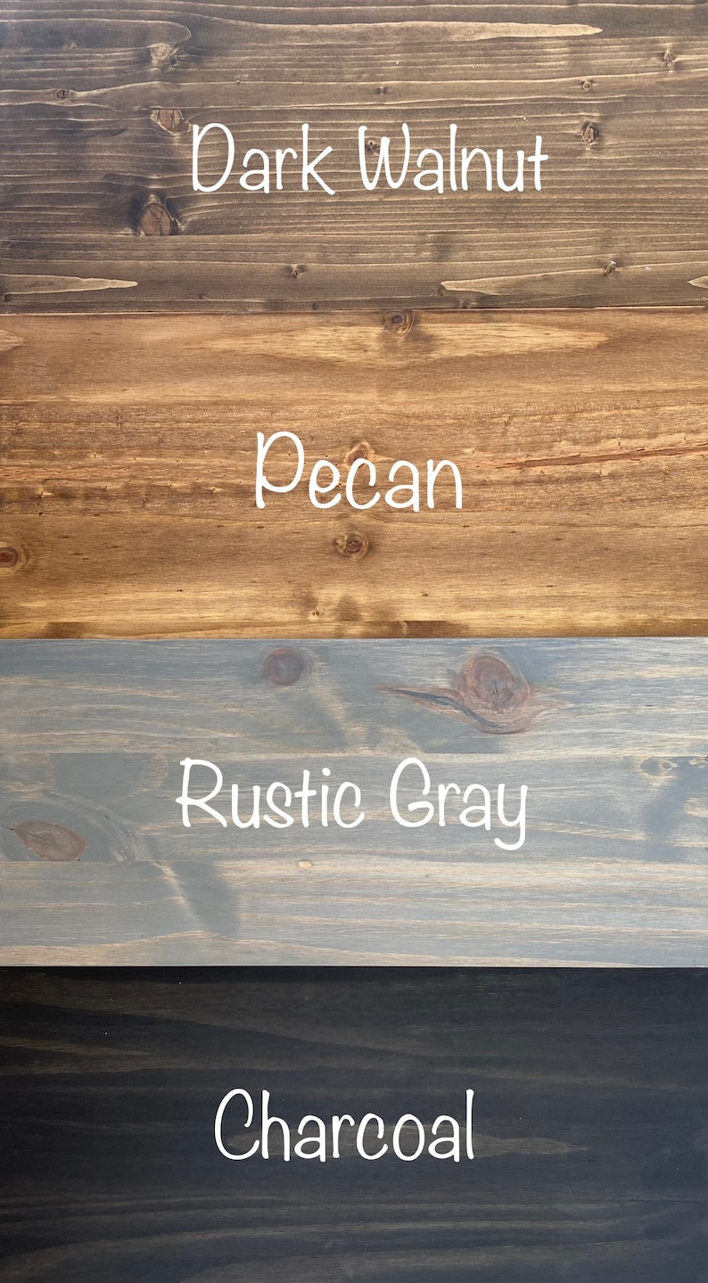May include: A vertical image showcasing four wood stain color options: Dark Walnut, Pecan, Rustic Gray, and Charcoal. Each color is displayed on a separate wooden plank, with the color name written in white script.