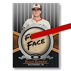 May include: A baseball card featuring a photo of Billy Ripken, a Baltimore Orioles player. The card has a black background with a silver circle in the center. The circle contains a wooden bat knob with the words "GAME-USED BAT KNOB" and "F*** FACE" written on it. The card also features the Fleer logo and the text "BILLY RIPKEN" and "BALTIMORE. 2B".