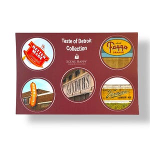May include: A maroon card featuring six circular images with Detroit-themed logos and text. The text includes "Taste of Detroit Collection", "Better Made Special", "Faygo Orange", "Sanders", "Vernor's Ginger Ale", and "Kowalski".