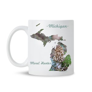 May include: White ceramic mug with a silhouette of the state of Michigan, featuring a morel mushroom in the center. The text "Morel Hunter" and "Michigan" are printed on the mug.