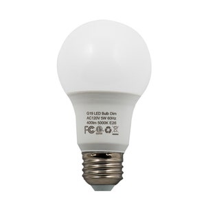 May include: A white LED light bulb with a G19 designation. The bulb is dimmable and has a 5W power rating. It is rated for 120V AC and 60Hz. The bulb has a 400lm brightness and a 5000K color temperature. The bulb has an E26 base. The bulb is labeled with FCC and CE certifications.