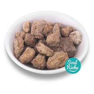May include: A white bowl filled with brown, irregularly shaped pieces of dried fruit. The bowl is on a white background. The text "Soul Niche" is in a teal circle on the right side of the image.