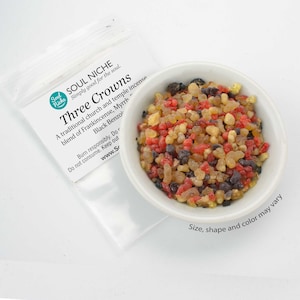May include: A white bowl filled with a blend of frankincense, myrrh, and black benzoin incense. The incense is a mix of red, brown, and black resin pieces. The bowl is on a white surface. The text on the bag reads "Soul Niche Simply good for the soul. Three Crowns A traditional church and temple incense blend of Frankincense, Myrrh Black Benzoin Burn responsibly. Do not consume. Keep out www.Sr Size, shape and color may vary"