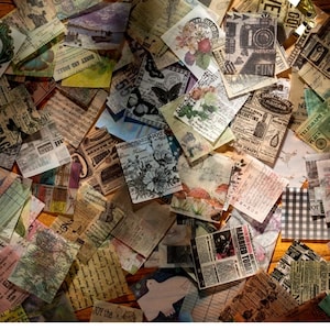 May include: A collection of vintage-style paper ephemera, including squares and rectangles with floral, butterfly, and newspaper designs. The papers feature faded colors and handwritten text, creating a collage effect. Some pieces have text that reads "Thank You!" and "Married Today".