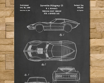 May include: Black chalkboard print of a Corvette Stingray C3 vehicle body design for a sports car. The print includes multiple views of the car, with text that reads "Corvette Stingray C3" and "Chalkboard".
