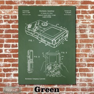 May include: A green and white patent drawing of the Nintendo Gameboy, a handheld video game system. The drawing shows the Gameboy's design and features, including its buttons, screen, and cartridge slot. The patent number, 5,184,830, is printed at the top right corner of the drawing. The text "Nintendo Gameboy" and "Compact Hand-Held Video Game System" are printed at the top of the drawing.