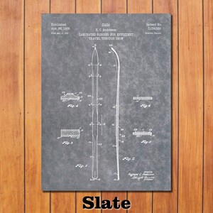 May include: A black and white patent drawing for a ski design. The drawing shows a side view of a ski with a laminated runner for efficient travel through snow. The patent was published on April 28, 1936, and filed on May 15, 1933. The patent number is 2,038,530.