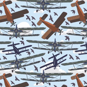 May include: A seamless pattern featuring a repeating design of vintage biplanes flying in a blue sky with white clouds. The planes are orange, gray, and black, and the pattern is perfect for fabric, wallpaper, or wrapping paper.