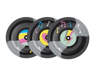 May include: Three black vinyl record-shaped paper plates with colorful designs. The designs include a rainbow, a heart, and a lightning bolt. Each plate has musical notes printed on it.