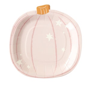 May include: Pink paper party plate shaped like a pumpkin with white stars.