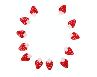 May include: A red and pink strawberry garland with white string. The garland is made of felt and has a simple design.