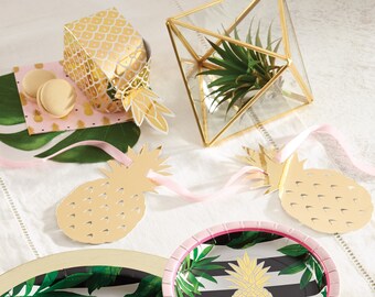 May include: Pineapple themed bridal shower party decorations, including plates, napkins, and a gold pineapple gift box. The decorations feature a tropical leaf pattern and gold pineapple accents.