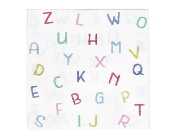 May include: White paper napkin with a colourful alphabet pattern. The letters are in different colours and sizes, and they are scattered randomly across the napkin.