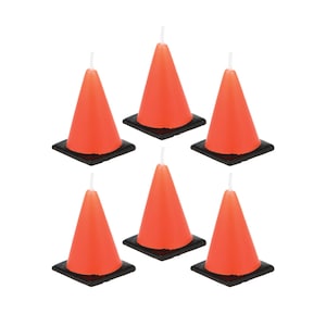 May include: Six orange traffic cone shaped candles with black bases. The candles are arranged in two rows of three.