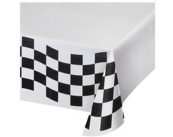 May include: White plastic tablecloth with a black and white checkered border. The border is a checkered flag design.