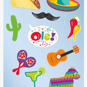 May include: A set of 10 colorful photo booth props with a Mexican fiesta theme. The props include a sombrero, a taco, a cactus, a maraca, a guitar, a margarita glass, a pinata, a mustache, a speech bubble with the word "Ole!" and a pair of chili peppers.