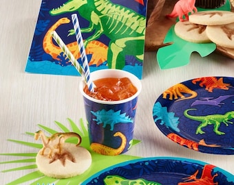 May include: A set of blue and green dinosaur-themed paper plates and cups. The plates feature a variety of dinosaurs in different poses, while the cups have a single dinosaur on each. The set is perfect for a dinosaur-themed party.