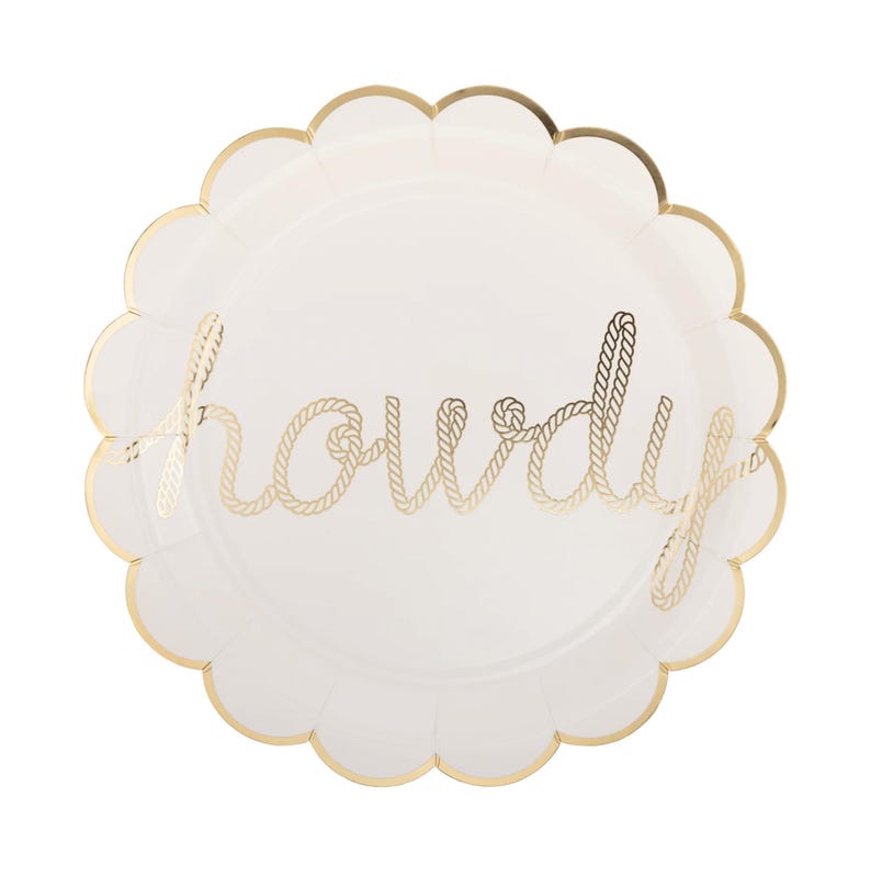 May include: A white paper plate with a scalloped gold edge. The word "howdy" is written in gold rope-style lettering across the center. This plate is suitable for a party or event.