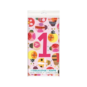 May include: Pink tablecloth with a large pink number one and a pattern of colorful ladybugs. The tablecloth is 54 inches by 84 inches.