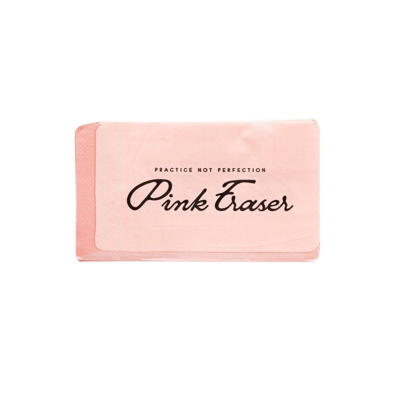 May include: A rectangular pink eraser with the words "Pink Eraser" in a cursive font and the phrase "PRACTICE NOT PERFECTION" in a smaller font. The eraser has a light pink hue and a textured surface.