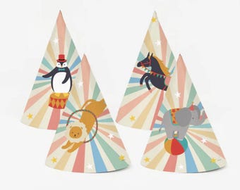 May include: Four party hats with circus animal designs. Each cone-shaped hat features a different illustration: a penguin, a lion, a horse, and an elephant. The hats have a colorful striped background with star accents, perfect for a birthday party.