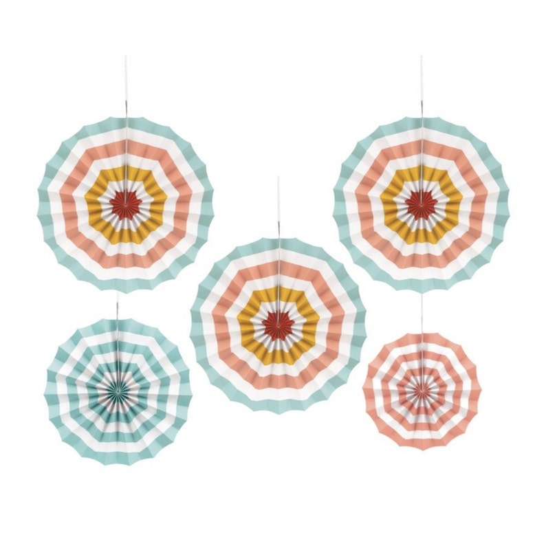 May include: Five paper fan decorations in a rainbow color scheme. The fans are made of paper and have a striped design. They are hung from the ceiling with string.
