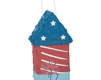 May include: A red, white, and blue paper piñata shaped like a firework. The top is blue with white stars, the middle is red with white stripes, and the bottom is light blue. A white handle is attached.
