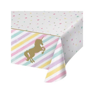 May include: A white plastic tablecloth with a gold unicorn silhouette and a pastel striped pattern. The tablecloth is decorated with a scattered pattern of small stars in various pastel colors.