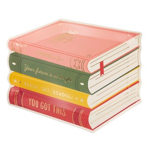 May include: A stack of four colorful paper plates shaped like books. The top plate is pink with the text "Learning is fun." The second plate is green with the text "Your future is so bright." The third plate is yellow with the text "Ready, Set, School!" The bottom plate is red with the text "You Got This."