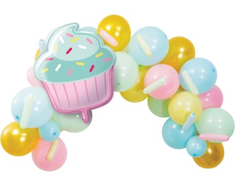 May include: A pastel balloon arch with a cupcake-shaped balloon in the center. The arch is made of light blue, yellow, pink, and green balloons. The cupcake balloon has pink frosting and green sprinkles.