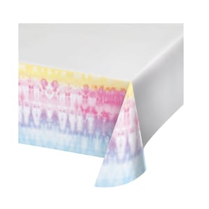 May include: A white plastic tablecloth with a tie-dye pattern in shades of yellow, pink, blue, and purple. The pattern is on the border of the tablecloth.