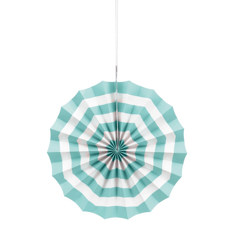 May include: A teal and white striped paper fan hanging from a white string. The fan is folded in a circle shape.