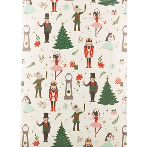 May include: White wrapping paper with a repeating pattern of a nutcracker, a mouse, a ballerina, a Christmas tree, a clock, and a man in a top hat. The pattern is in shades of red, green, blue, and gold.