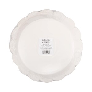May include: A stack of white paper plates with a scalloped edge, wrapped in clear plastic. The plates are 9 inches in diameter. The packaging includes the text "My Mind's Eye Paper Goods".