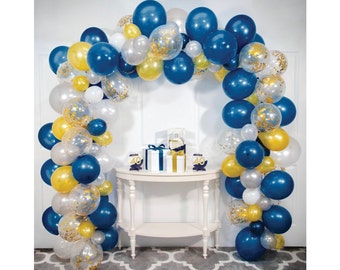 May include: A blue, gold, and white balloon arch with confetti. The arch is decorated with balloons of various sizes and is perfect for a party or celebration.