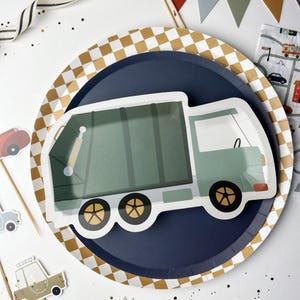 May include: A blue and gold checkered paper plate with a green and blue garbage truck design. The truck has a white cab and black wheels.