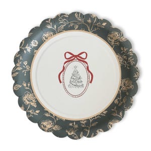 May include: A round, scalloped-edge plate with a Christmas tree design. The plate has a dark teal floral border with gold accents. The center features a red ribbon and a Christmas tree illustration.