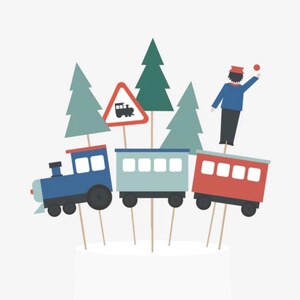 May include: A whimsical cake topper featuring a blue train engine, a light blue train car, and a red train car. The scene includes green trees, a train crossing sign, and a conductor. The topper is designed to sit atop a cake.
