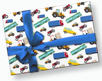 May include: A blue ribbon tied around a gift box with a white background. The wrapping paper features a repeating pattern of colorful trucks, cars, tractors, and motorcycles.