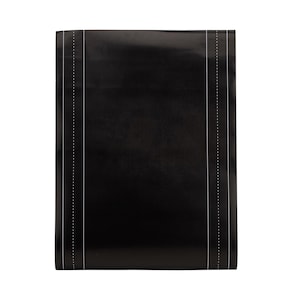 May include: A black, rectangular item with white, dotted lines running vertically along the edges. The item has a glossy finish and appears to be folded or rolled. The white lines are thin and evenly spaced, creating a subtle contrast against the dark background.