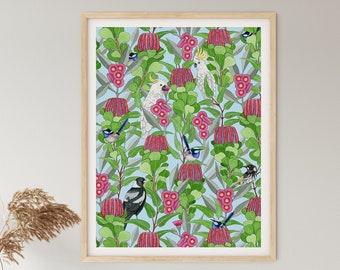 May include: A framed print of a blue and green floral pattern with pink flowers and birds. The print is hanging on a white wall above a white dresser with three drawers.