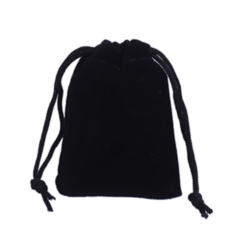 May include: A black velvet drawstring bag with a black cord.