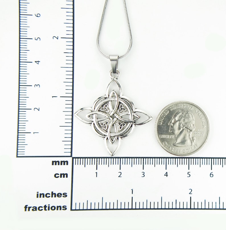 May include: Silver Celtic knot pendant necklace with a chain. The pendant is about 1 inch in diameter and is shown next to a US quarter for size comparison.