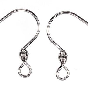 May include: Two silver earring hooks with a coiled wire detail.