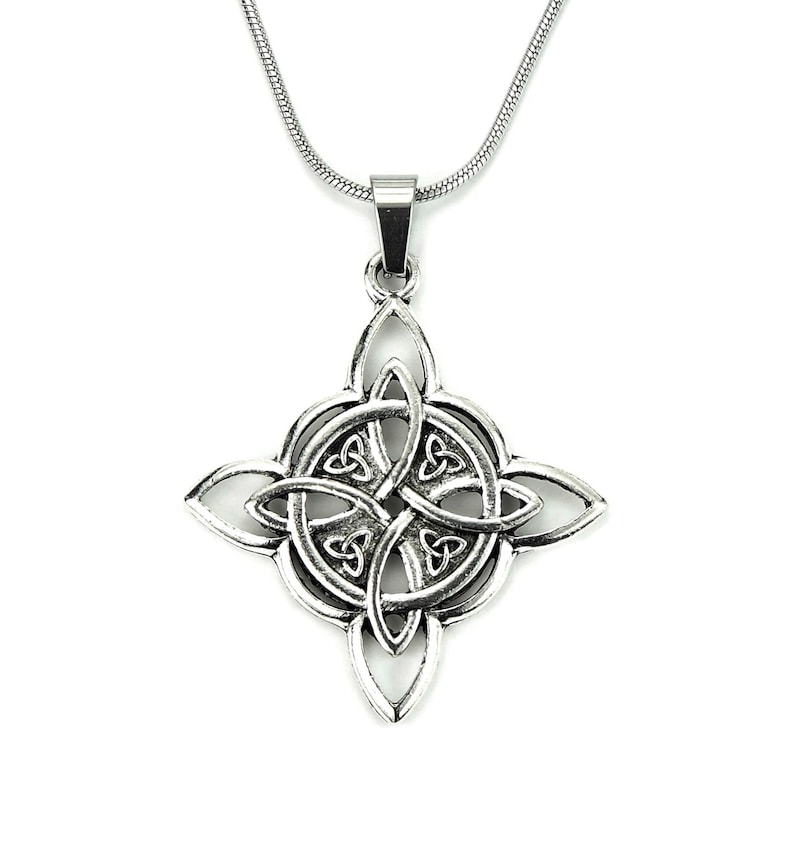 May include: A silver Celtic knot pendant necklace with a four-leaf clover design. The pendant is intricate and detailed, with a silver chain.