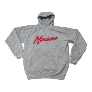 May include: A gray hooded sweatshirt with a red "Marines" logo printed on the front.