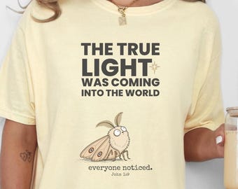 Comfort Colors® Christian Christmas Shirt, John 1:9 True Light Tee, Funny Moth Faith Shirt, Christmas Church Gift for Men Women